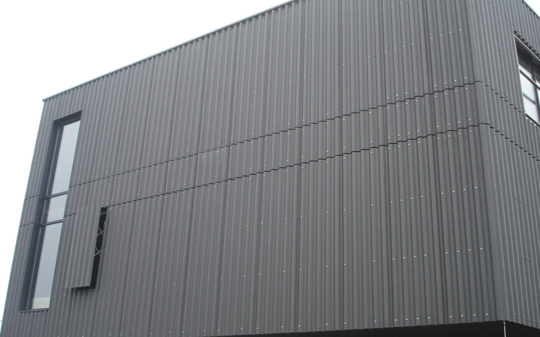 Corrugated fibre-cement facades